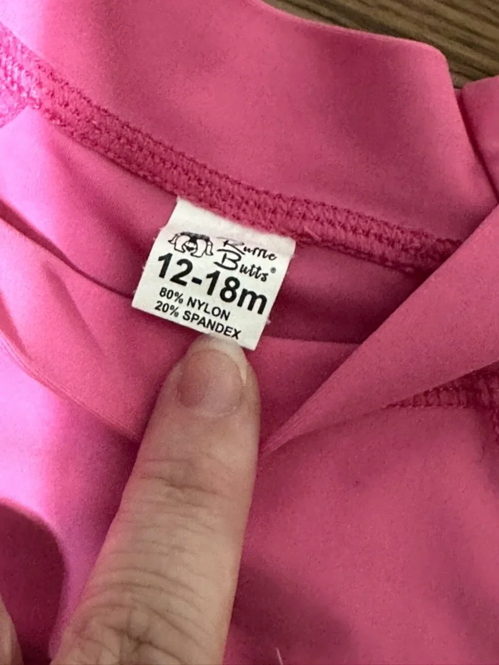Ruffle Butts Rashgaurd size 12-18 months Pink heart print with ruffle sleeve